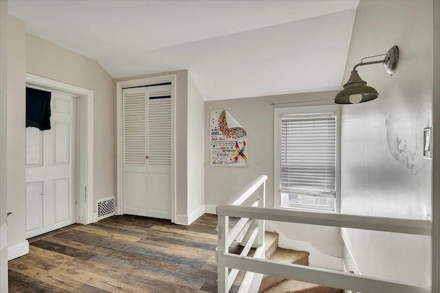 24 Wagner St, Call Listing Agent, NY 13339 - corridor featuring lofted ceiling, dark wood-style flooring, and baseboards