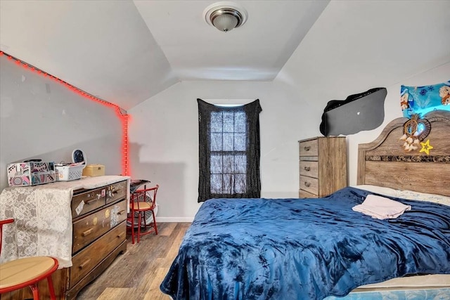 24 Wagner St, Call Listing Agent, NY 13339 - bedroom with wood finished floors, lofted ceiling, and baseboards