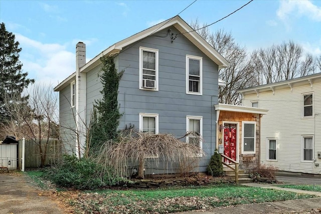 24 Wagner St, Call Listing Agent, NY 13339 - traditional home featuring a chimney and fence