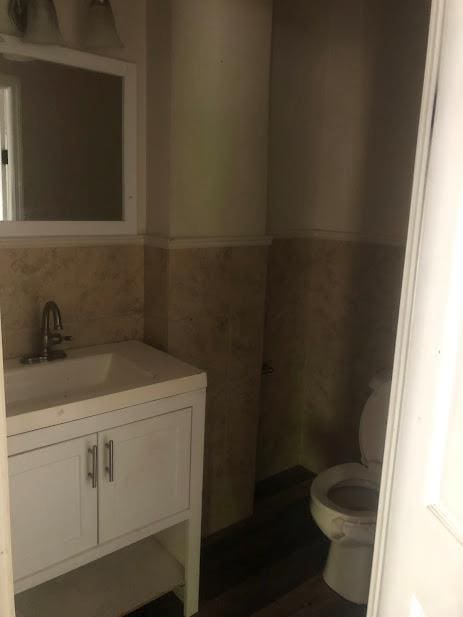 24 Wagner St, Call Listing Agent, NY 13339 - bathroom featuring toilet and vanity