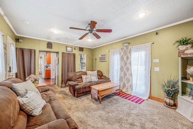 living room with a textured ceiling, carpet floors, ceiling fan, and crown molding