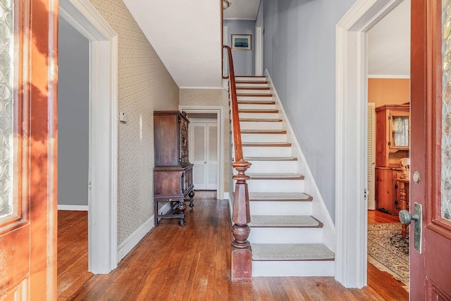 staircase featuring hardwood / wood-style flooring