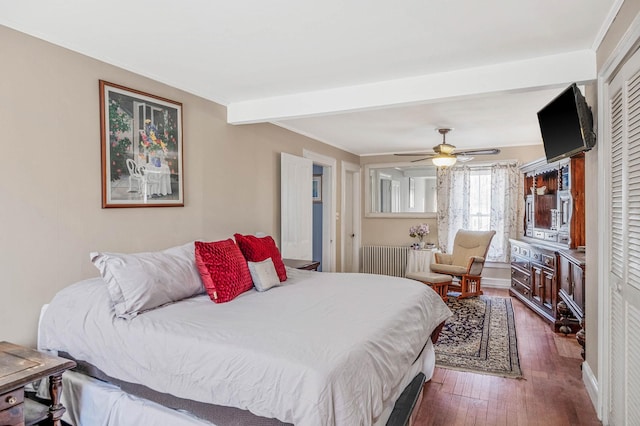 bedroom featuring a closet, ceiling fan, beam ceiling, and dark wood-type flooring