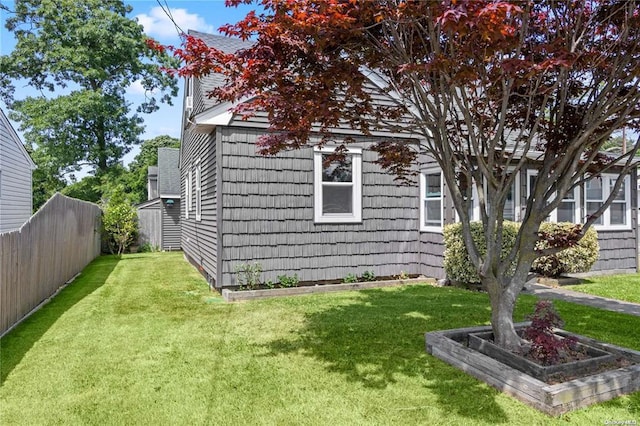 view of property exterior featuring a yard