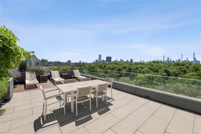 285 W 110th St Unit 2A, New York Manhattan, NY 10026 - view of patio / terrace with a skyline view and outdoor dining area