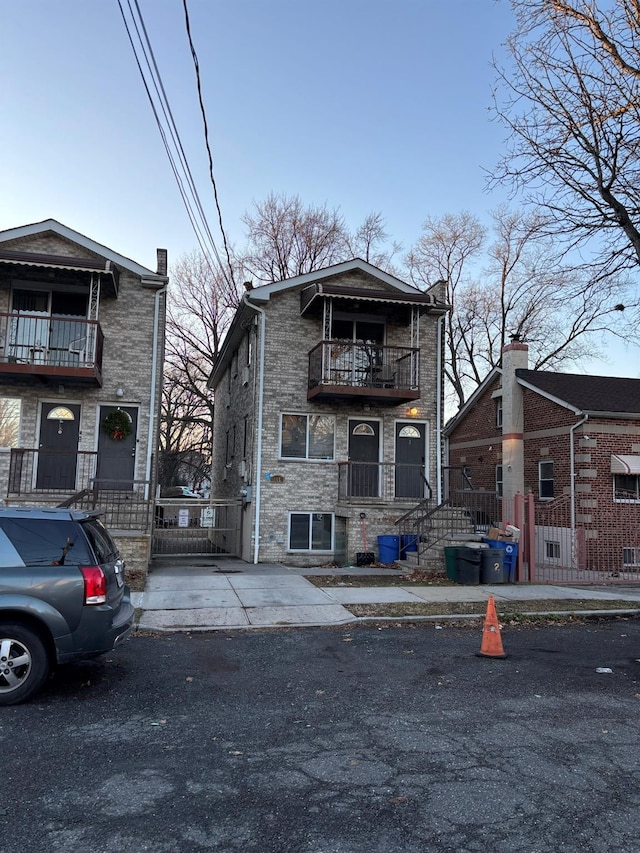 view of front of home with a balcony