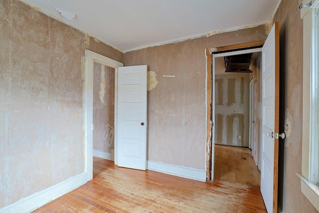 spare room with light hardwood / wood-style flooring