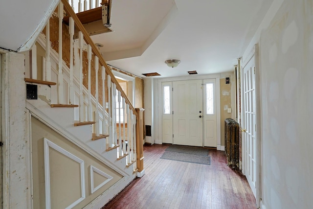 foyer entrance with hardwood / wood-style flooring