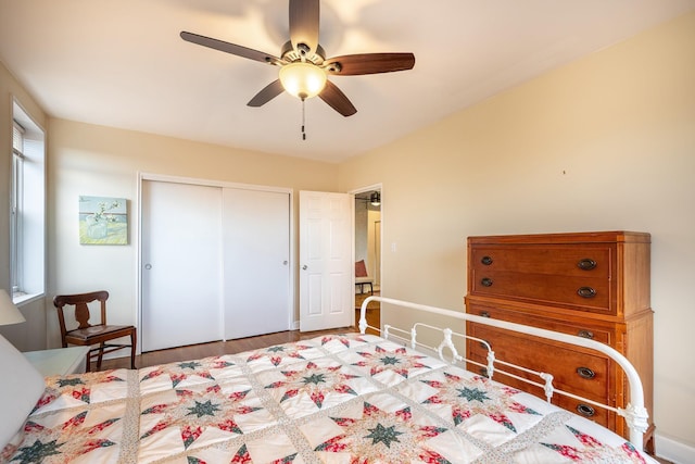 bedroom featuring ceiling fan, a closet, and hardwood / wood-style floors