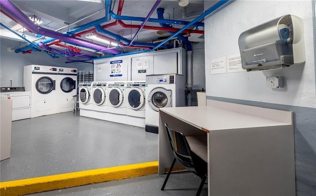 washroom with washing machine and clothes dryer