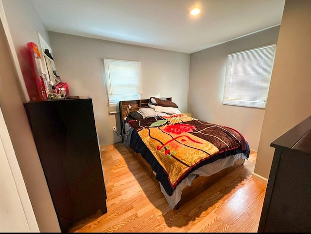 bedroom with light hardwood / wood-style floors