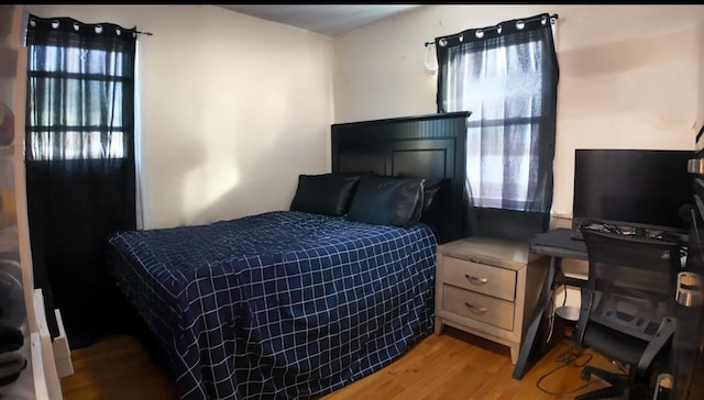 bedroom with light hardwood / wood-style floors