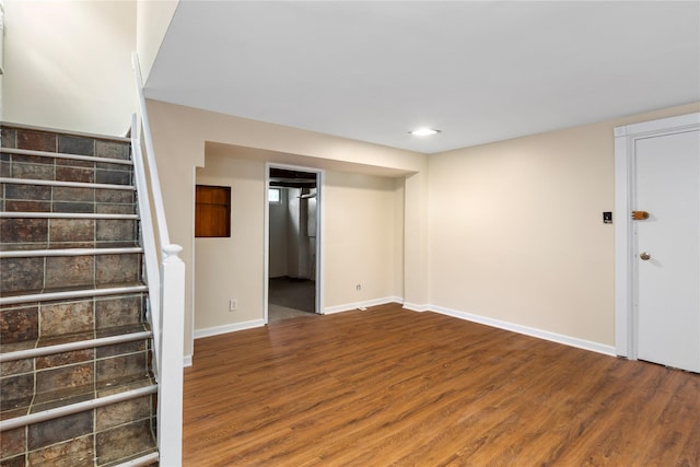 basement featuring wood-type flooring