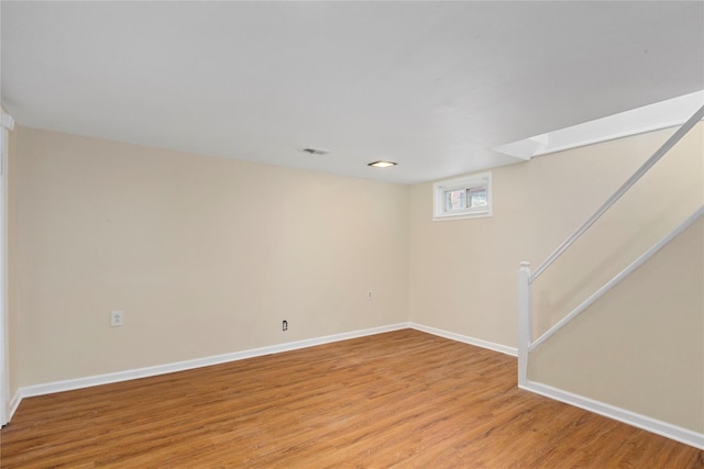 basement featuring light hardwood / wood-style floors