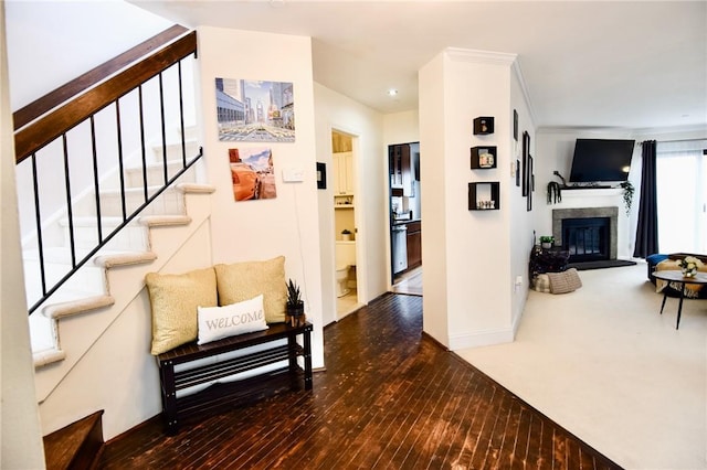 hall featuring hardwood / wood-style floors and ornamental molding