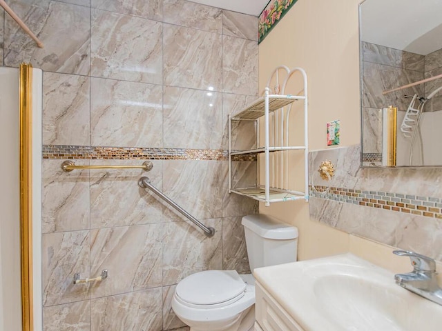 bathroom featuring toilet, vanity, and tiled shower