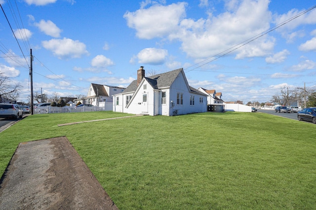 view of home's exterior featuring a yard