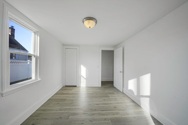 spare room featuring light hardwood / wood-style floors