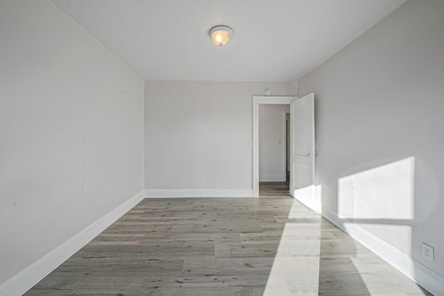 unfurnished room with light hardwood / wood-style flooring