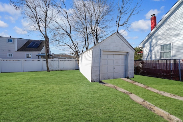 view of yard with a garage and an outdoor structure