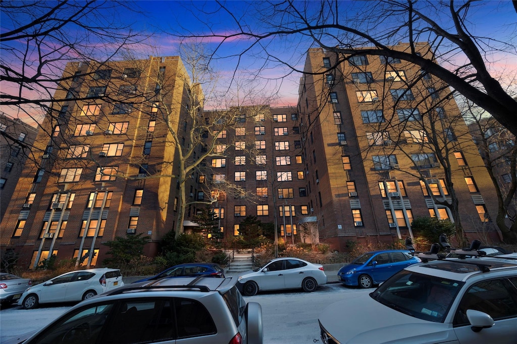 view of outdoor building at dusk