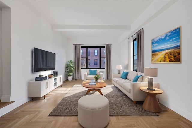 living room with beam ceiling and light parquet floors