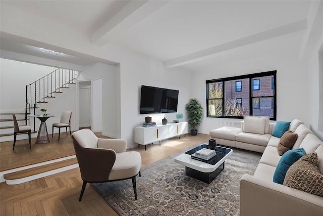 living room with beam ceiling and parquet floors