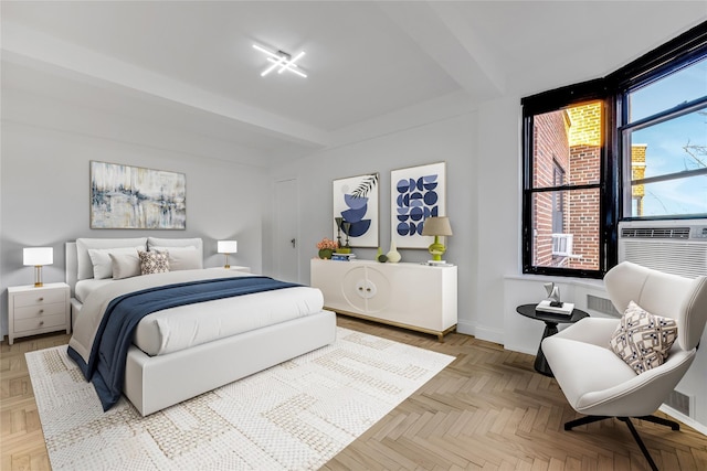 bedroom featuring beamed ceiling, cooling unit, and light parquet flooring