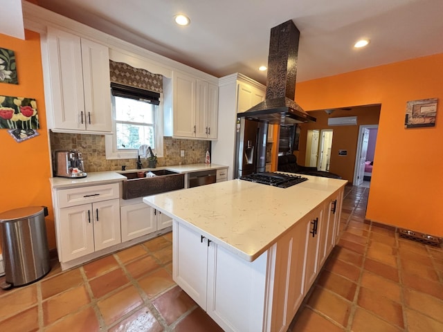 45 Lynbrook Ave, Lynbrook, NY 11563 - kitchen featuring island exhaust hood, dishwashing machine, white cabinetry, tasteful backsplash, and a center island