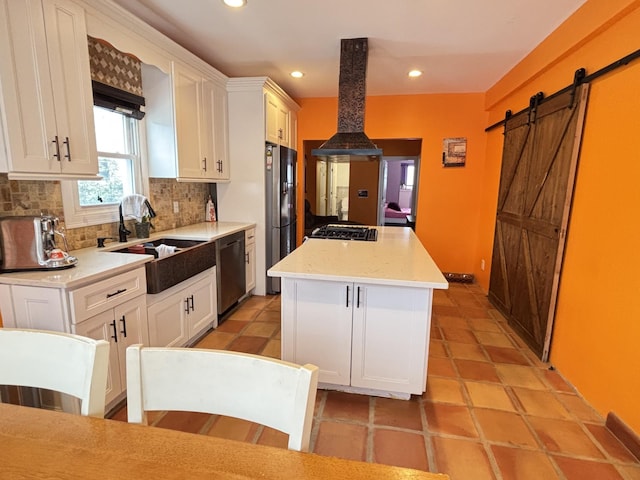 45 Lynbrook Ave, Lynbrook, NY 11563 - kitchen with appliances with stainless steel finishes, wall chimney exhaust hood, a center island, tasteful backsplash, and white cabinets