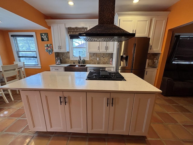 45 Lynbrook Ave, Lynbrook, NY 11563 - kitchen featuring wall chimney exhaust hood, stainless steel fridge with ice dispenser, decorative backsplash, black gas stovetop, and healthy amount of natural light