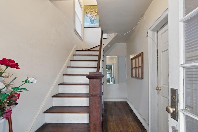 stairway featuring hardwood / wood-style floors