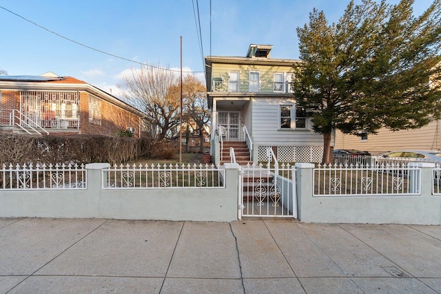 view of front of house featuring a balcony