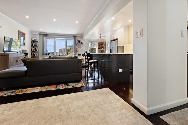 living room with ceiling fan, dark hardwood / wood-style floors, and ornamental molding