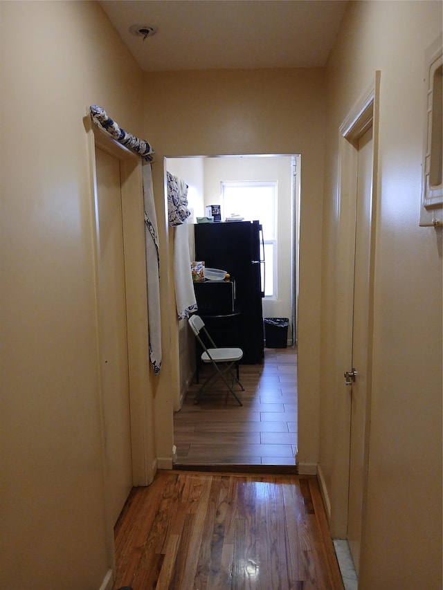 hall featuring dark wood-type flooring