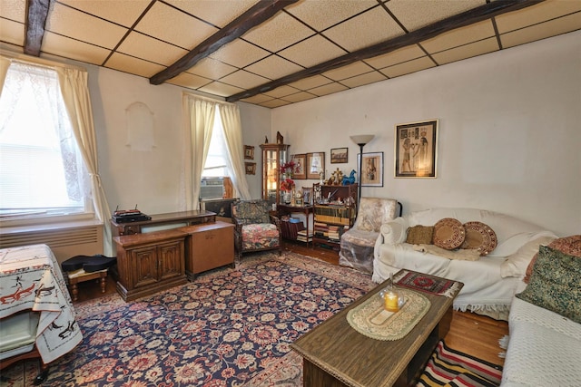 living room with a drop ceiling