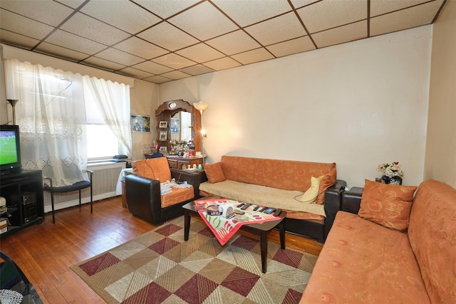 living room featuring radiator and dark hardwood / wood-style flooring