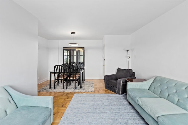 living room featuring parquet flooring