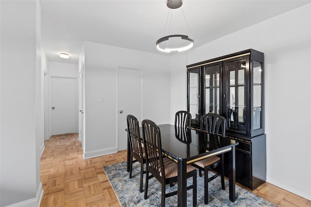 dining room featuring light parquet flooring