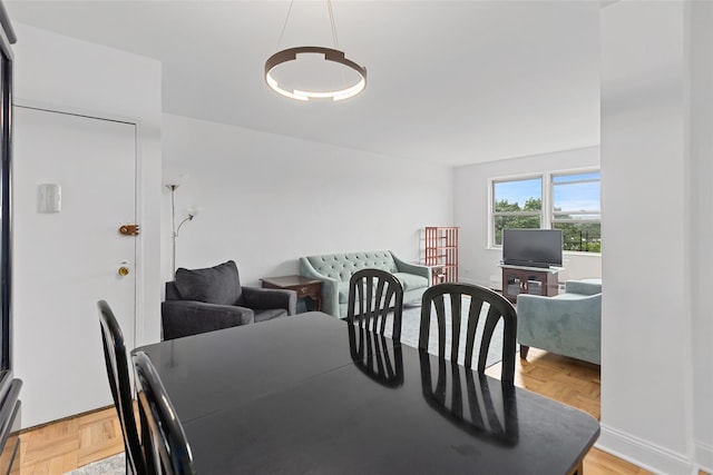 dining room featuring light parquet flooring