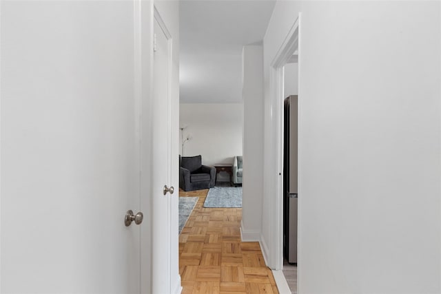 corridor with light parquet flooring