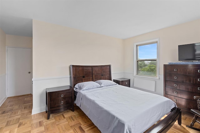 bedroom featuring light parquet flooring