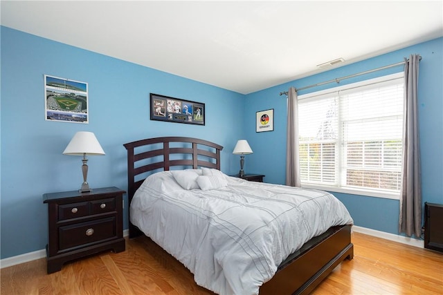 bedroom with light hardwood / wood-style flooring