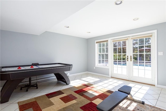 playroom with light tile patterned flooring and french doors