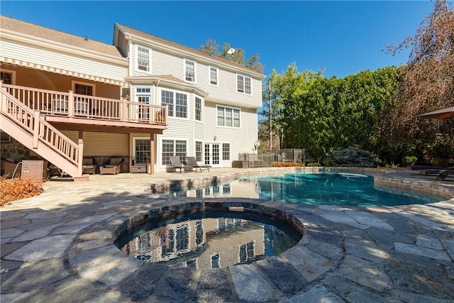 view of swimming pool with a patio area and an in ground hot tub