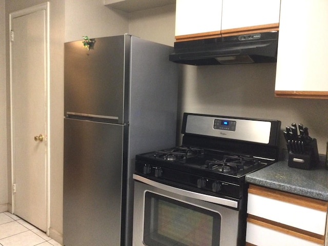 kitchen featuring light tile patterned flooring and appliances with stainless steel finishes