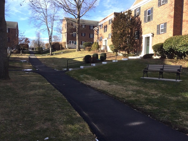 view of community featuring a yard