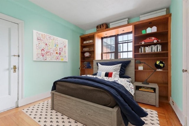 bedroom with light wood-type flooring