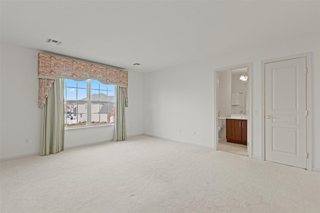 carpeted empty room with sink