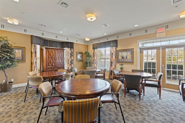 dining space featuring carpet